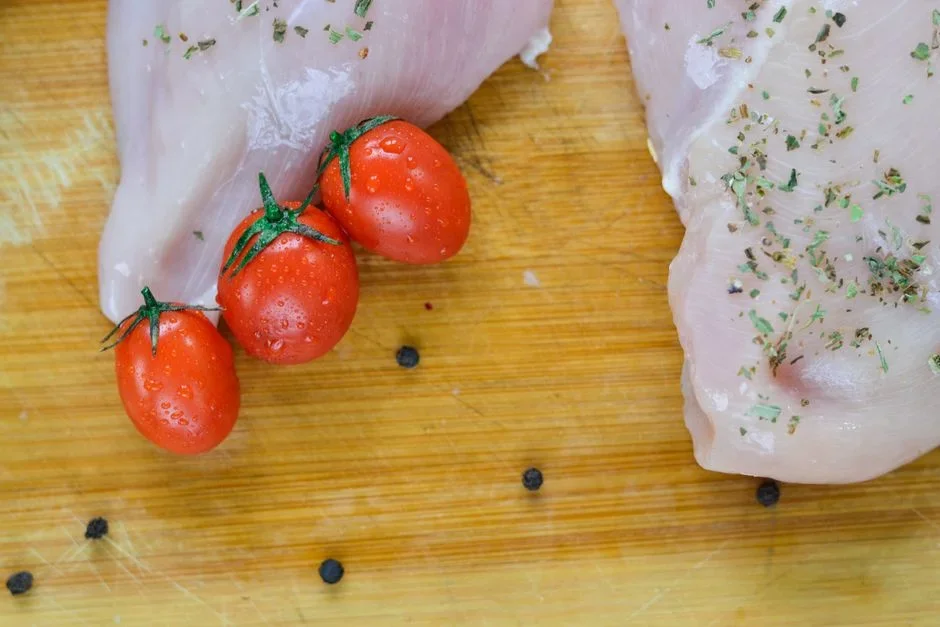 Raw chicken thawing on a kitchen counter at room temperature, a food safety hazard