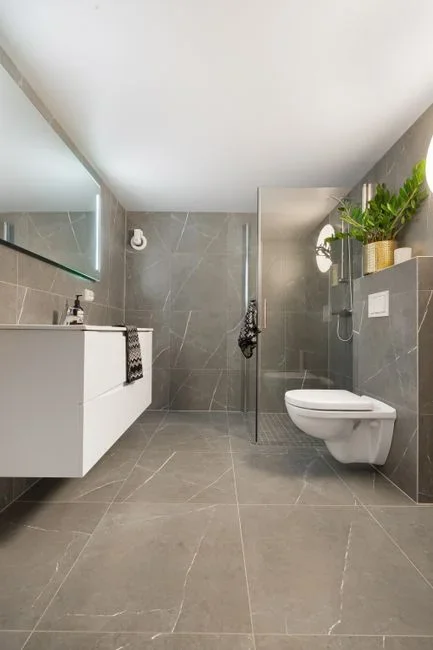 Nonporous (tile, porcelain, glass, sealed metal, the tub itself): clean it and dry it. It stays. Porous (drywall, grout, caulk, ceiling tiles, carpet)