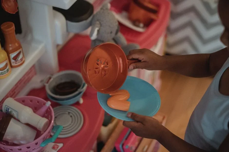 Aerosol total release fogger can standing on a kitchen floor beside a pet food bowl and a child's toy